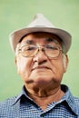 Portrait of serious old man with hat looking at camera Royalty Free Stock Photo