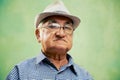 Portrait of serious old man with hat looking at camera Royalty Free Stock Photo