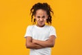 Offended young black girl standing with folded arms Royalty Free Stock Photo