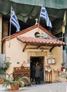 People enetering in small church in the center of Athens