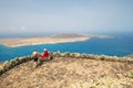 People enjoing Impressive view from Mirador del Rio to island of La Graciosa, Lanzarot