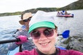 People enjou kayaking on beautiful river. Summer sunny time Royalty Free Stock Photo