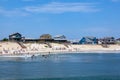 people enjoy bathing in Nags Head, USA. Established in the 1830s as first tourist colony. The first oceanfront cottage was built