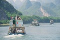 People enjoy boat cruise by the Li (Lijang) river between Guilin and Yangshuo, Guilin, China.