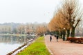 People enjoy in calming nature and winter scenes around lake in center of Malmo in Sweden