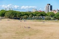 People enjoy the Castle field wide space in a sunny day in Portsmouth UK