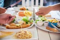 People enjoy eat spaghetti and steak together in a big meal set Royalty Free Stock Photo