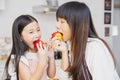 People enjoy eating apple fruits for healthy lifestyle at home with children