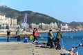 People enjoy fishing at Xinghai Bay. Chinese Leisure activity