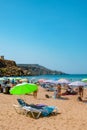 people enjoy the Golden Bay beach in Mellieha, Malta Royalty Free Stock Photo