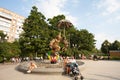 People enjoy a rest near Clowns sculpture in Moscow 12.08.2017