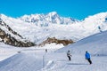 People enjoy ski and snowboard for winter holiday in Alps area with Mont Blanc as background, Les Arcs 2000, Savoie, France,