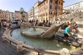 People enjoy Spanish stairs on Piazza di Spagna in Rome. Spanish stairs with the Fountain Barcaccia in Rome is famous touristic