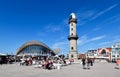 People enjoy a summer day at the lighthouse and at the landmark Teepot in the Baltic Sea resort of WarnemÃÂ¼nde Royalty Free Stock Photo