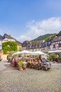 people enjoy the summer day at market place with medival half timbered houses in Bernkastel-Kues Royalty Free Stock Photo