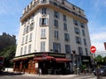 People enjoy a sunny afternoon at a Parisian cafe terrace Royalty Free Stock Photo