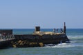 People enjoy a sunny day on breakwater at Tel Aviv harbor Royalty Free Stock Photo