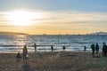 People enjoy the sunset at English Bay Beach, Vancouver City beautiful nature landscape. Royalty Free Stock Photo