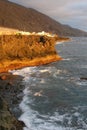 People enjoy the sunset on the rocks along the Atlantic ocean, La palma