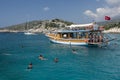 People enjoy swimming in the Mediterranean Sea after jumping off their cruise boat.