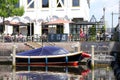 Vessels and a cosy terrace of Dara restaurant along the Eem river, Amersfoort, Netherlands