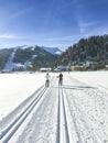 people enjoy the trail for cross-country skiing with scenic winter snow landscape in Tirol in Achenkirch