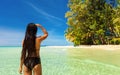 People enjoy vacation on tropical sandy beach on background sea water and blue sky Royalty Free Stock Photo