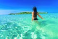 People enjoy vacation on tropical sandy beach on background sea water and blue sky Royalty Free Stock Photo