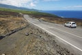 People enjoy the view to the asphalt road over volcanic lava in Sainte-Rose De La Reunion, France.