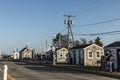 People enjoy a warm summer day in the historic harbor with old fishermen huts in Provincetown, USA