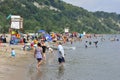People enjoy the warm summer weather at Bluffer`s Park Beach