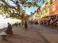 People enjoying afternoon sun on seaside promenade in Meersburg Germany Royalty Free Stock Photo