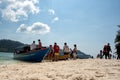 Tourist spend time at a beach in Pulau Beras Basah in Langkawi, Malaysia