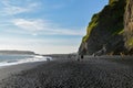 People enjoying beautiful sunny weather on Reynisfjara beach