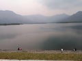 People enjoying the beauty of the lake and sorrounding mountains