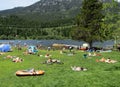 People are enjoying boating and swimming in Alta lake, Whistler, BC, Canada Royalty Free Stock Photo