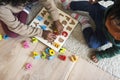 People enjoying Christmas holiday alphabets toy playing