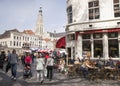 People enjoying a drink on the market near breda cathedral