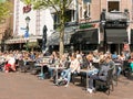 People having drinks on outdoor terrace of cafe, Holland