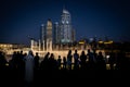 People enjoying the Dubai Fountain show at night | Downtown Dubai landmarks and attractions - The Dubai Mall | Souk al Bahar Royalty Free Stock Photo