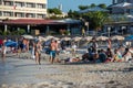 People enjoying the Es Pujols beach in Formentera, Spain in the summer of 2021 Royalty Free Stock Photo