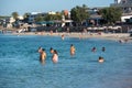 People enjoying the Es Pujols beach in Formentera, Spain in the summer of 2021 Royalty Free Stock Photo