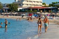 People enjoying the Es Pujols beach in Formentera, Spain in the summer of 2021 Royalty Free Stock Photo