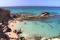 People enjoying Escalo d'es Mort beach early in the morning. formentea, Spain. Royalty Free Stock Photo