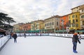 People enjoying ice skating rink