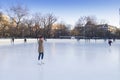 People enjoying ice skating rink