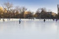 People enjoying ice skating rink