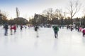 People enjoying ice skating rink