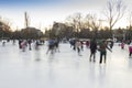 People enjoying ice skating rink