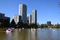 People enjoying a summer day in swan-shaped pedal boats in the lake in Ueno Park in Tokyo, Japan Royalty Free Stock Photo